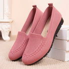 Roze gebreide damesschoenen met zwarte zool, comfortabele instappers, modieus en casual, perfect voor dagelijks gebruik en wandelingen.